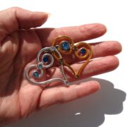 double-heart-brooch-silver-and-gold-perspective